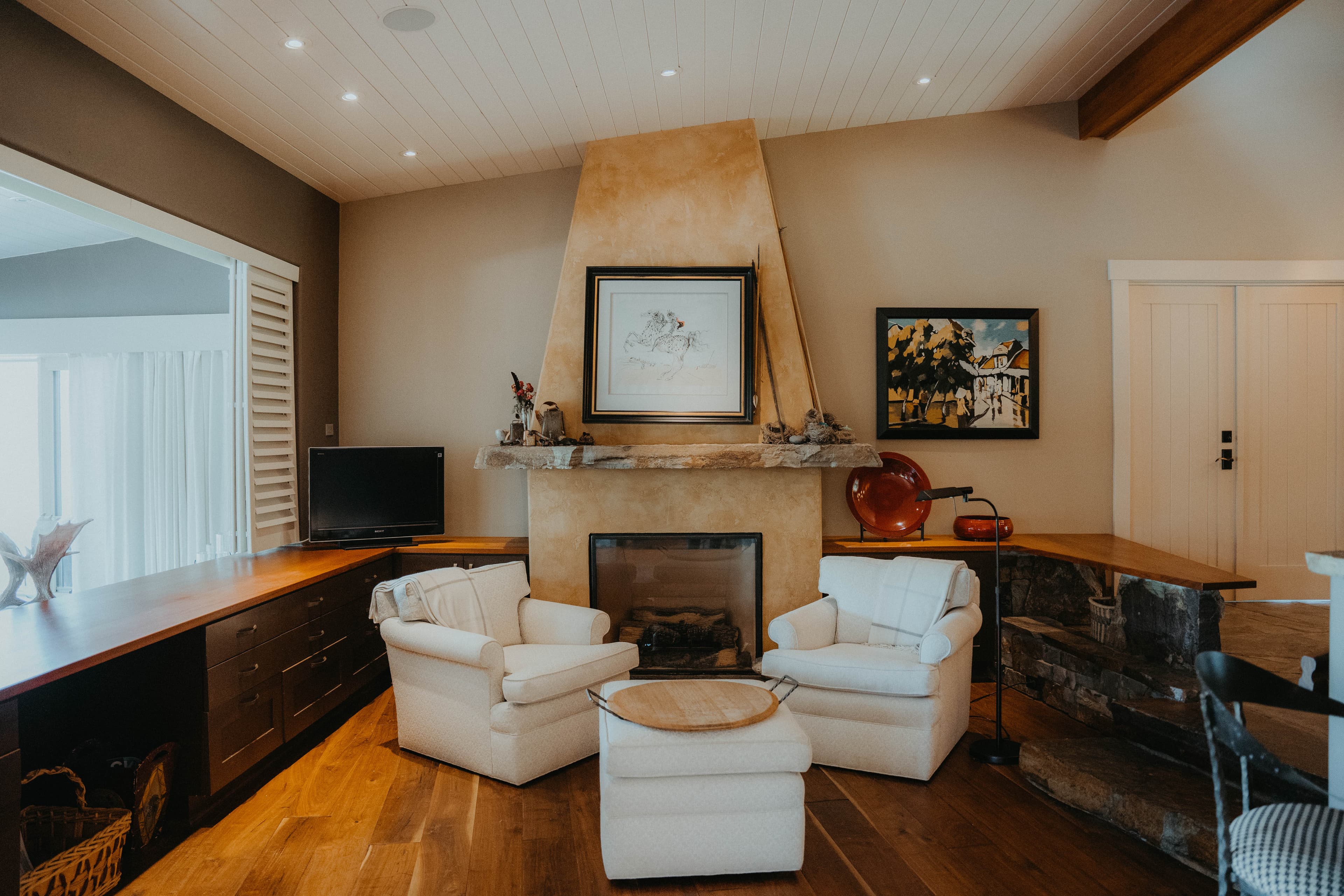Sitting room with built-ins and fireplace