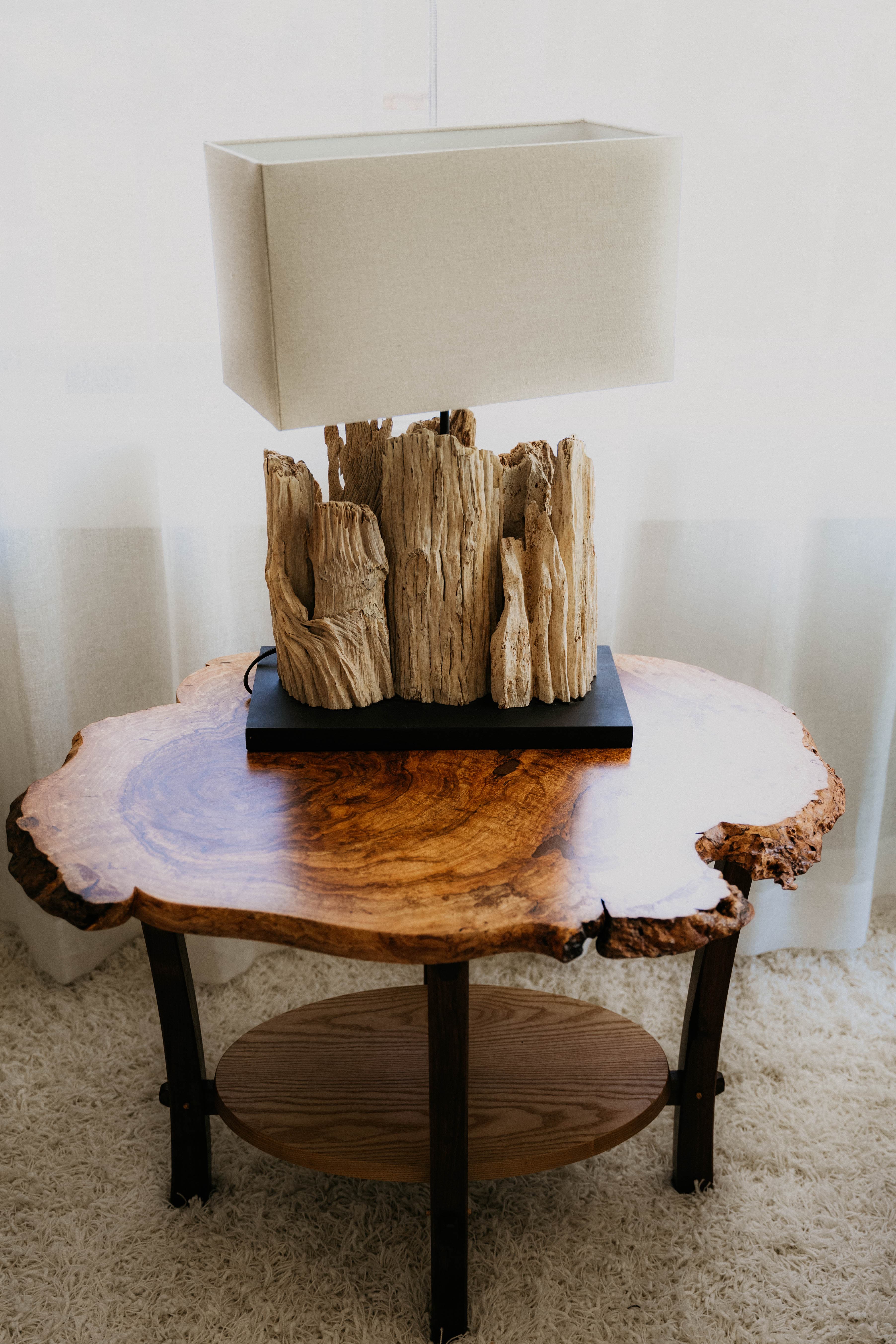 Live-edge table with driftwood lamp